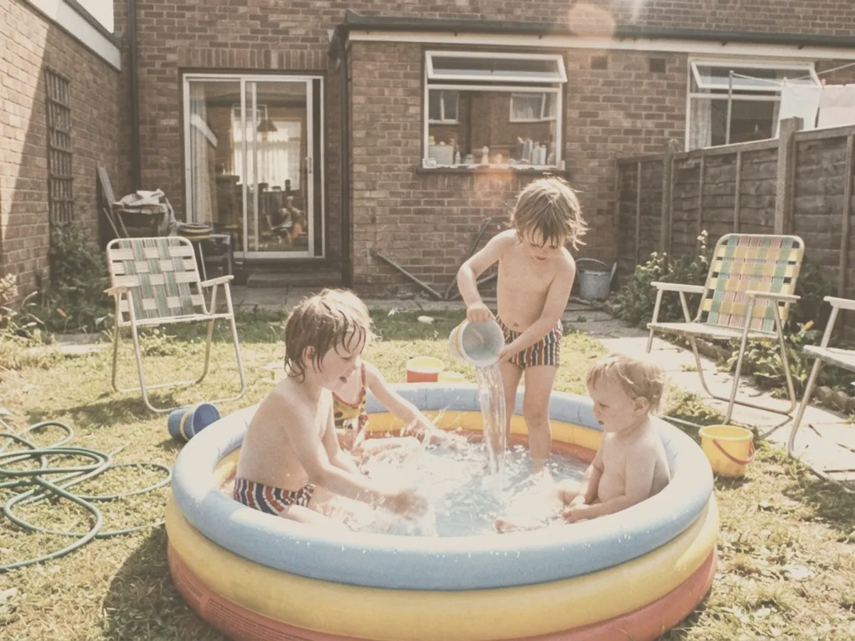 The paddling pool photo as it lies faded in the album